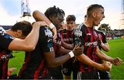 28 July 2023; Jonathan Afolabi of Bohemians celebrates with teammates after scoring their side's first goal, from a penalty, during the SSE Airtricity Men's Premier Division match between Bohemians and UCD at Dalymount Park in Dublin. Photo by Ramsey Cardy/Sportsfile