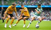 29 July 2023; Leil Abada of Celtic in action against Craig Dawson, left, and Matheus Nunes of Wolverhampton Wanderers during the pre-season friendly match between Celtic and Wolverhampton Wanderers at the Aviva Stadium in Dublin. Photo by Seb Daly/Sportsfile