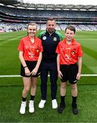30 July 2023; Referee David Gough with INTO Cumann na mBunscol GAA Respect Exhibition Go Games referees, Emma Thorp, St Fiachra's SNS, Beamount, Dublin, and Billy Lappin, St Pius X BNS, Terenure, Dublin, ahead of the INTO Cumann na mBunscol GAA Respect Exhibition Go Games at the GAA Football All-Ireland Senior Championship final match between Dublin and Kerry at Croke Park in Dublin. Photo by Daire Brennan/Sportsfile