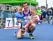 30 July 2023; Brendan Boyce of Finn Valley AC, Donegal, with his children Tom and Isabelle age 2, after the 10000m walk during day two of the 123.ie National Senior Outdoor Championships at Morton Stadium in Dublin. Photo by Stephen Marken/Sportsfile