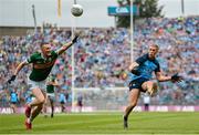 30 July 2023; Paul Mannion of Dublin kicks a point, under pressure from Kerry's Jason Foley, during the GAA Football All-Ireland Senior Championship final match between Dublin and Kerry at Croke Park in Dublin. Photo by Seb Daly/Sportsfile