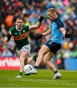 30 July 2023; Paul Mannion of Dublin kicks a point despite the efforts of Tadhg Morley of Kerry to give Dublin the lead in the 74th minute during the GAA Football All-Ireland Senior Championship final match between Dublin and Kerry at Croke Park in Dublin. Photo by Brendan Moran/Sportsfile