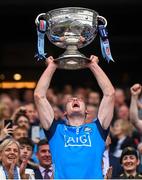30 July 2023; Brian Fenton of Dublin lifts the Sam Maguire cup after the GAA Football All-Ireland Senior Championship final match between Dublin and Kerry at Croke Park in Dublin. Photo by Ramsey Cardy/Sportsfile