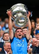 30 July 2023; Niall Scully of Dublin lifts the Sam Maguire Cup after his side's victory in the GAA Football All-Ireland Senior Championship final match between Dublin and Kerry at Croke Park in Dublin. Photo by Seb Daly/Sportsfile