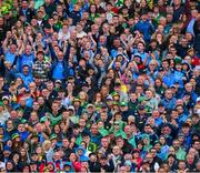 30 July 2023; Dublin supporters, in the Hogan Stand, celebrate a score during the GAA Football All-Ireland Senior Championship final match between Dublin and Kerry at Croke Park in Dublin. Photo by Ray McManus/Sportsfile