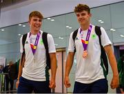 30 July 2023; Time Trial Silver medalist Conor Murphy, left, and Discus Bronze medalist Cian Crampton upon Team Ireland's return to Dublin Aiport from the 2023 Summer European Youth Olympic Festival in Maribor, Slovenia. Photo by Tyler Miller/Sportsfile