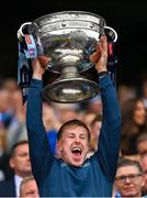 30 July 2023; Seán Bugler of Dublin lifts the Sam Maguire Cup after his side's victory in the GAA Football All-Ireland Senior Championship final match between Dublin and Kerry at Croke Park in Dublin. Photo by Seb Daly/Sportsfile