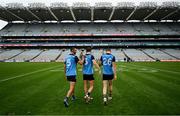 30 July 2023; Dublin players, from left, James McCarthy, Michael Fitzsimons and Dean Rock walk out to the middle of the pitch following the celebrations after their victory in the GAA Football All-Ireland Senior Championship final match between Dublin and Kerry at Croke Park in Dublin. Photo by Brendan Moran/Sportsfile