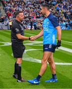 30 July 2023; Referee David Gough greets James McCarthy the Dublin captain ahead of the GAA Football All-Ireland Senior Championship final match between Dublin and Kerry at Croke Park in Dublin. Photo by Ray McManus/Sportsfile