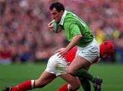 21 March 1998; Eric Elwood of Ireland is tackled by Kingsley Jones of Wales during the Five Nations Rugby Championship match between Ireland and Wales at Lansdowne Road in Dublin, Ireland. Photo by Brendan Moran/Sportsfile