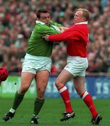 21 March 1998; Rob Henderson of Ireland is tackled by Neil Jenkins of Wales during the Five Nations Rugby Championship match between Ireland and Wales at Lansdowne Road in Dublin, Ireland. Photo by David Maher/Sportsfile