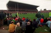 21 March 1998; Supporters sitting on the pitch behing the goalline on the north end of the stadium during the Five Nations Rugby Championship match between Ireland and Wales at Lansdowne Road in Dublin, Ireland. Photo by David Maher/Sportsfile