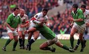 4 April 1998; Jeremy Guscott of England is tackled by Reggie Corrigan of Ireland during the Five Nations Rugby Championship match between England and Ireland at Twickenham Stadium in London, England. Photo by Matt Browne/Sportsfile