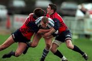 14 February 1998; Jeremy Hastings of Dungannon is tackled by Paul Flavin, left, and David Johnson of Blackrock College during the All-Ireland League Division 1 match between Blackrock College RFC and Dungannon RFC at Stradbrook Road in Dublin. Photo by Brendan Moran/Sportsfile