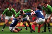 7 March 1998; Kevin Maggs of Ireland is tackled by Thomas Castaignede, left, and Marc Lievremont of France during the Five Nations Rugby Championship match between France and Ireland at the Stade De France in Paris, France. Photo by Brendan Moran/Sportsfile