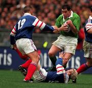 7 March 1998; Andy Ward of Ireland is tackled by Thomas Castaignede of France during the Five Nations Rugby Championship match between France and Ireland at the Stade De France in Paris, France. Photo by Brendan Moran/Sportsfile