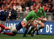 7 March 1998; Conor McGuinness of Ireland is tackled by Fabien Pelous of France during the Five Nations Rugby Championship match between France and Ireland at the Stade De France in Paris, France. Photo by Brendan Moran/Sportsfile