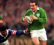 18 January 1997; Conor O'Shea of Ireland is tackled by Émile Ntamack of France during the Five Nations Rugby Championship match between Ireland and France at Lansdowne Road in Dublin. Photo by Brendan Moran/Sportsfile