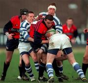 14 February 1998; David Moore of Blackrock College is tackled by Ashley Blair, left, Keith Walker and Michael Pattan of Dungannon during the All-Ireland League Division 1 match between Blackrock College RFC and Dungannon RFC at Stradbrook Road in Dublin. Photo by Matt Browne/Sportsfile