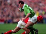 21 March 1998; Eric Elwood of Ireland is tackled by Kingsley Jones of Wales during the Five Nations Rugby Championship match between Ireland and Wales at Lansdowne Road in Dublin, Ireland. Photo by Brendan Moran/Sportsfile