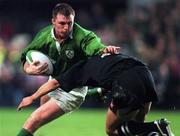 15 November 1997; Eric Miller of Ireland is tackled by Alama Ieremia of New Zealand during the Autumn International match between Ireland and New Zealand at Lansdowne Road in Dublin, Ireland. Photo by Ray McManus/Sportsfile