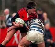 14 February 1998; Hubie Kos of Blackrock College is tackled by Michael Pattan of Dungannon during the All-Ireland League Division 1 match between Blackrock College RFC and Dungannon RFC at Stradbrook Road in Dublin. Photo by Matt Browne/Sportsfile