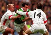 4 April 1998; Eric Elwood of Ireland is tackled by Neil Back, left, and Mike Catt of England during the Five Nations Rugby Championship match between England and Ireland at Twickenham Stadium in London, England. Photo by Brendan Moran/Sportsfile