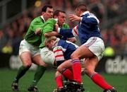 7 March 1998; Rob Henderson of Ireland, supported by team-mate Eric Elwood, is tackled by Thomas Castaignede and Philippe Benetton, right, of France during the Five Nations Rugby Championship match between France and Ireland at the Stade De France in Paris, France. Photo by Brendan Moran/Sportsfile