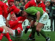 21 March 1998; Victor Costello of Ireland is tackled by Neil Jenkins of Wales on the way to scoring his side's second try during the Five Nations Rugby Championship match between Ireland and Wales at Lansdowne Road in Dublin, Ireland. Photo by David Maher/Sportsfile