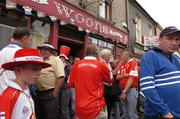 27 June 2004; Supporters of both teams drink beer outside a pub before making their way to the stadium. Guinness Munster Senior Hurling Championship Final, Cork v Waterford, Semple Stadium, Thurles, Co. Tipperary. Picture credit; Ray McManus / SPORTSFILE
