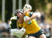 27 June 2004; Simon Hockings, Australia, is tackled by Andries Bekker, South Africa. IRB U21 World Championship 3rd/4th place play-off Australia v South Africa, Hughenden, Glasgow, Scotland. Picture credit; Brendan Moran / SPORTSFILE