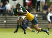 27 June 2004; Luvo Sogidashe, South Africa, in action against Digby Ioane, Australia. IRB U21 World Championship 3rd/4th place play-off Australia v South Africa, Hughenden, Glasgow, Scotland. Picture credit; Brendan Moran / SPORTSFILE