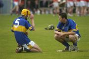 27 June 2004; Shane O'Brien, 5, and Joey McLoughney, Tipperary, show their dissapointment after defeat to Cork. Munster Minior Hurling Championship Final, Cork v Tipperary, Semple Stadium, Thurles, Co. Tipperary. Picture credit; Pat Murphy / SPORTSFILE