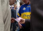 27 June 2004; Ticket touting in Thurles square before the Munster hurling final. Guinness Munster Senior Hurling Championship Final, Cork v Waterford, Semple Stadium, Thurles, Co. Tipperary. Picture credit; Ray McManus / SPORTSFILE