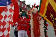27 June 2004; Cork fans dressed in their county colours make their way to the stadium. Guinness Munster Senior Hurling Championship Final, Cork v Waterford, Semple Stadium, Thurles, Co. Tipperary. Picture credit; Ray McManus / SPORTSFILE