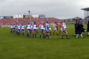 27 June 2004; The Waterford and Cork teams during the pre-match parade. Guinness Munster Senior Hurling Championship Final, Cork v Waterford, Semple Stadium, Thurles, Co. Tipperary. Picture credit; Ray McManus / SPORTSFILE