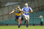 26 June 2004; Liam Tynan, Laois, is tackled by Gerry Quinn, Clare. Guinness Senior Hurling Championship Qualifier, Round 1, Clare v Laois, Gaelic Grounds, Limerick. Picture credit; Ray McManus / SPORTSFILE