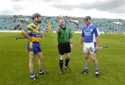 26 June 2004; Referee Michael Haverty makes the toss between Clare's Sean McMahon and David Cuddy, Laois. Guinness Senior Hurling Championship Qualifier, Round 1, Clare v Laois, Gaelic Grounds, Limerick. Picture credit; Ray McManus / SPORTSFILE