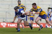 26 June 2004; David Cuddy, Laois, is tackled by Diarmuid McMahon, Clare. Guinness Senior Hurling Championship Qualifier, Round 1, Clare v Laois, Gaelic Grounds, Limerick. Picture credit; Ray McManus / SPORTSFILE