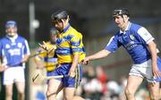 26 June 2004; David Forde, Clare, in action against Paul Cuddy, Laois. Guinness Senior Hurling Championship Qualifier, Round 1, Clare v Laois, Gaelic Grounds, Limerick. Picture credit; Ray McManus / SPORTSFILE