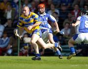 26 June 2004; Colin Lynch, Clare, in action against Laois's James Young, left, and James Walsh. Guinness Senior Hurling Championship Qualifier, Round 1, Clare v Laois, Gaelic Grounds, Limerick. Picture credit; Ray McManus / SPORTSFILE