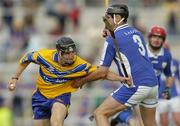 26 June 2004; Gerry Quinn, Clare, in action against Paul Cuddy, Laois. Guinness Senior Hurling Championship Qualifier, Round 1, Clare v Laois, Gaelic Grounds, Limerick. Picture credit; Ray McManus / SPORTSFILE