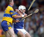 26 June 2004; Liam Tynan, Laois, is tackled by Clare's Diarmuid McMahon. Guinness Senior Hurling Championship Qualifier, Round 1, Clare v Laois, Gaelic Grounds, Limerick. Picture credit; Ray McManus / SPORTSFILE