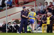 26 June 2004; James O'Connor is congratulated by Clare manager Anthony Daly as he leaves the field having been substituted. Guinness Senior Hurling Championship Qualifier, Round 1, Clare v Laois, Gaelic Grounds, Limerick. Picture credit; Ray McManus / SPORTSFILE