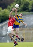 3 July 2004; Dermot Hurley, Cork, in action against Ger Quinlan, Clare. Bank of Ireland Football Championship Qualifier, Round 2, Clare v Cork, Cusack Park, Ennis, Co. Clare. Picture credit; Ray McManus / SPORTSFILE