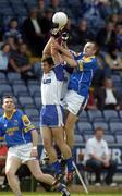 3 July 2004; David Hannify, Longford, in action against Paul OIgle, and Trevor Costelloe, hidden, Waterford. Bank of Ireland Football Championship Qualifier, Round 2, Longford v Waterford, O'Moore Park, Portlaoise, Co. Laois. Picture credit; Pat Murphy / SPORTSFILE