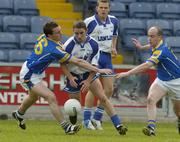 3 July 2004; Niall Hennessy, Waterford, in action against David Barden, left, and Padraic Davis, Waterford. Bank of Ireland Football Championship Qualifier, Round 2, Longford v Waterford, O'Moore Park, Portlaoise, Co. Laois. Picture credit; Pat Murphy / SPORTSFILE