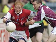 3 July 2004; Thomas Meehan, Galway, in action against J.P. Rooney, Louth. Bank of Ireland Football Championship Qualifier, Round 2, Galway v Louth, Parnell Park, Dublin. Picture credit; SPORTSFILE