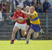 3 July 2004; Alan Cronin, Cork, in action against Ronan Slattery, Clare.. Bank of Ireland Football Championship Qualifier, Round 2, Clare v Cork, Cusack Park, Ennis, Co. Clare. Picture credit; Ray McManus / SPORTSFILE