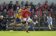 3 July 2004; Derek Kavanagh, Cork, in action against Sean O'Meara, Clare.. Bank of Ireland Football Championship Qualifier, Round 2, Clare v Cork, Cusack Park, Ennis, Co. Clare. Picture credit; Ray McManus / SPORTSFILE